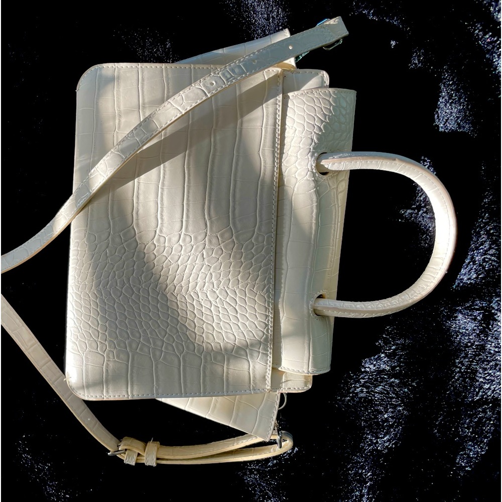 Cream colored patterned faux leather handbag